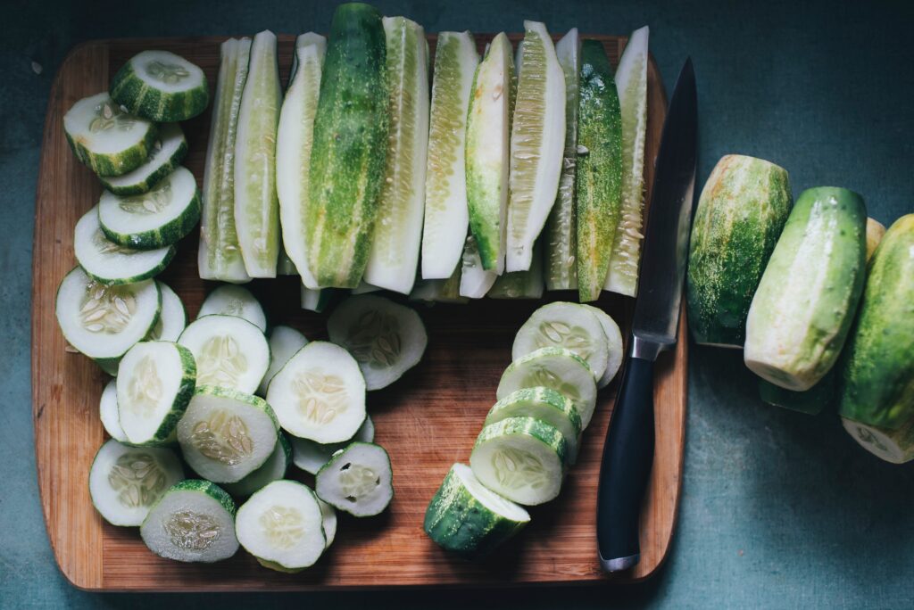 cucumbers beside silver knife