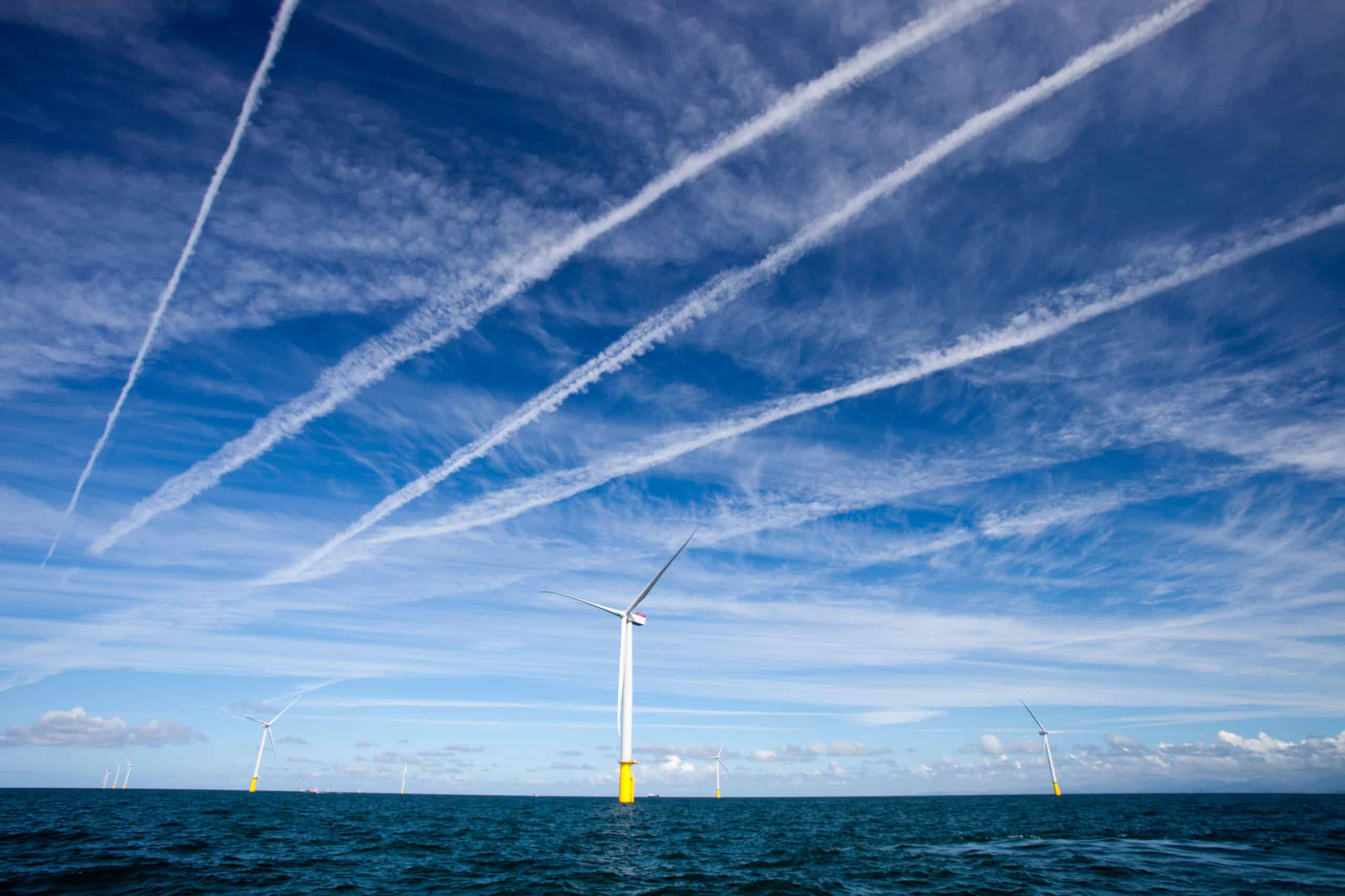 C6EJWA Contrails over  wind turbines in the Walney offshore wind farm.